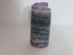 Polished purple and green fluorite crystal tower