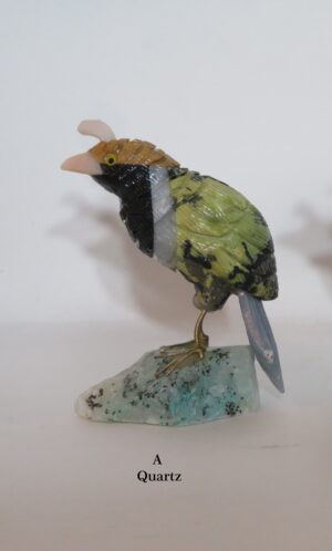 Green quartz bird figurine on mineral base